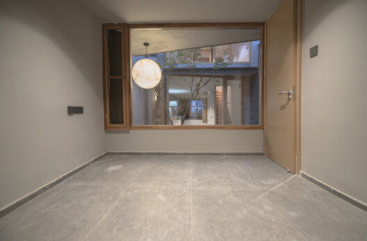 Longhouse in Beijing Hutong / Jin Lei - Interior Photography, Wood, Lighting, Door, Glass, Concrete