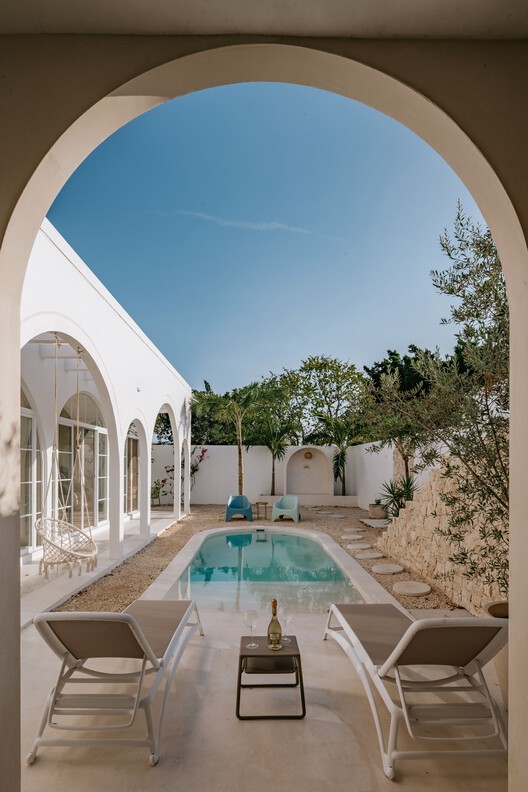 Villa Nink El Arca / Arquitectura Elemental - Fotografía interior, Puerta, Arco, Concreto, Patio interior, Patio, Arcada