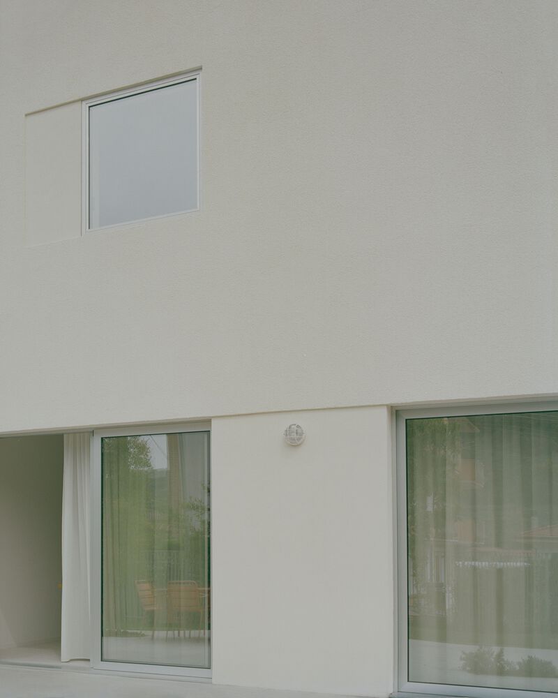 Casa con una ventana cuadrada / Set Architects - Fotografía interior