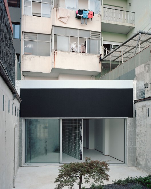 Oasis under a Building / fala - Interior Photography, Concrete