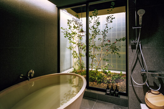 Private lodging in Minato-ku / FujiwaraMuro Architects - Interior Photography, Bathroom, Glass, Bathtub, Sink, Toilet