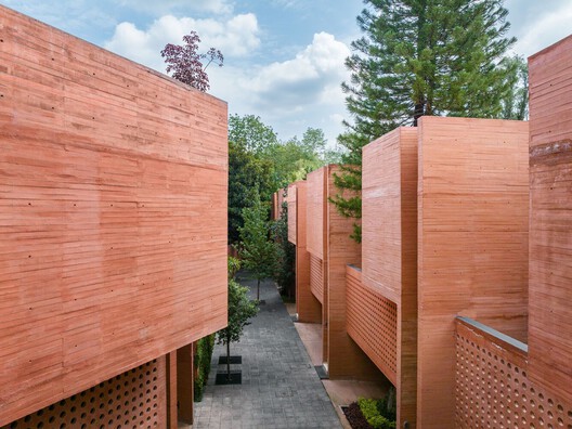More Than Gray: 15 Projects That Explore Red Pigmented Concrete - Image 25 of 32