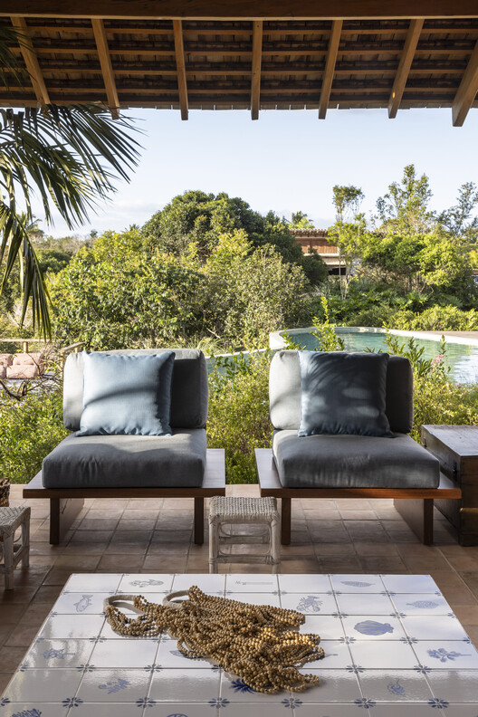 Ība House / Daniel Fromer - Exterior Photography, Garden, Chair, Patio