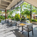 Phum Sambo Café & Eatery / Khoan + Partners - Interior Photography, Adaptive Reuse, Courtyard, Beam, Chair