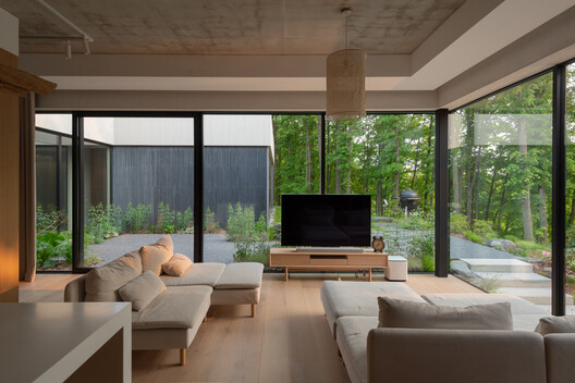 House in Kaunas / Architectural Bureau G.Natkevicius & Partners - Interior Photography, Living Room, Wood, Sofa, Glass, Chair