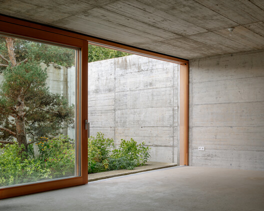 House with two Courtyards / BÜRO MÜHLBAUER - Image 11 of 21