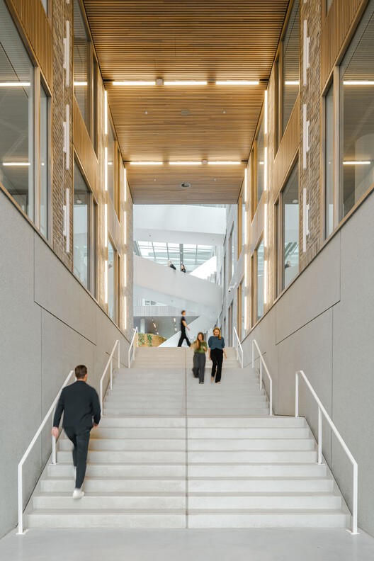 5TRACKS Mixed-Use District / Shift Architecture Urbanism + Powerhouse Company - Interior Photography, Stairs, Wood, Glass, Concrete, Handrail