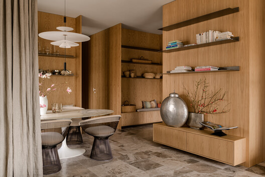 Luxury Apartament in Poznań / Studio GAB Luxury Apartament in Poznań / Studio GAB - Interior Photography, Wood, Lighting, Table, Chair, Shelving