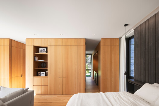 The House of la Baie de l’Ours / ACDF Architecture - Interior Photography, Wood, Bedroom, Bed, Door, Closet, Shelving