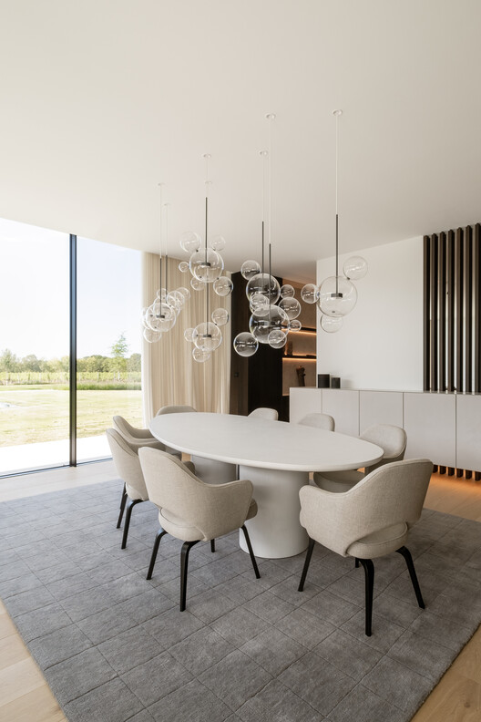 Concrete Villa / Cocoon Architecten Concrete Villa / Cocoon Architecten - Interior Photography, Lighting, Chair