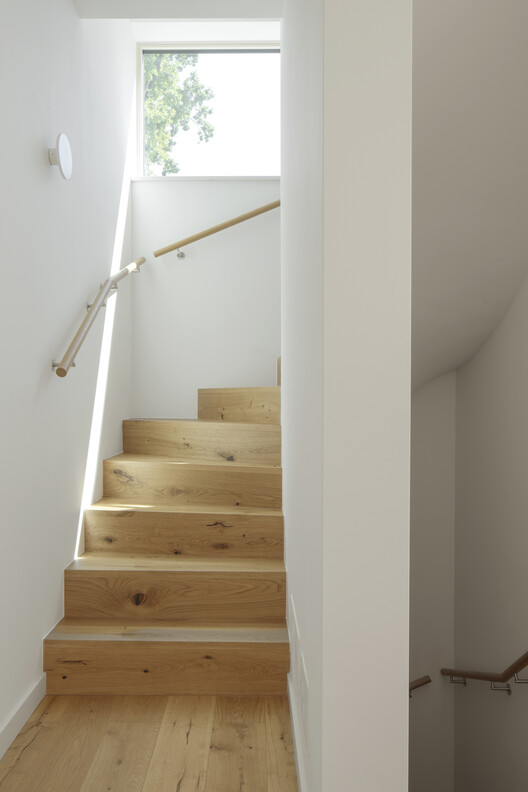 Modular Timber Residential Quarter Am Rathausplatz / kontektum architektur + Boschmann + Feth Architekten - Interior Photography, Stairs, Wood, Handrail