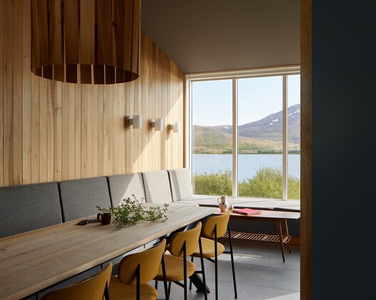 Holiday Home in Iceland / Teiknistofan Tröð Holiday Home in Iceland / Teiknistofan Tröð - Interior Photography, Dining room, Wood, Table, Lighting, Chair, Glass