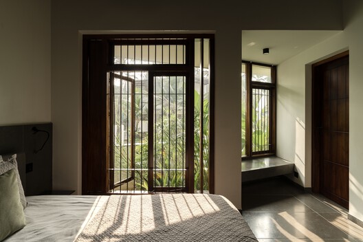 Residência Borda Infinita / TROPICAL TONES - Fotografia de Interiores, Dormitório, Madeira, Cama