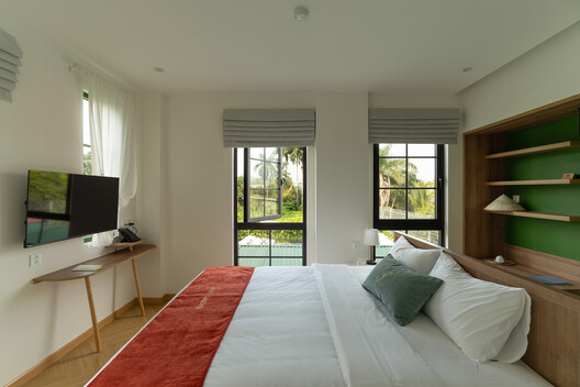 Sadec Garden Hotel / PAU Architects Sadec Garden Hotel / PAU Architects - Interior Photography, Bedroom, Bed, Chair