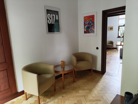 Renovation Casa d'Abreu Neto - Siza's First Work / Álvaro Siza Vieira - Interior Photography, Living Room, Wood, Chair, Lighting