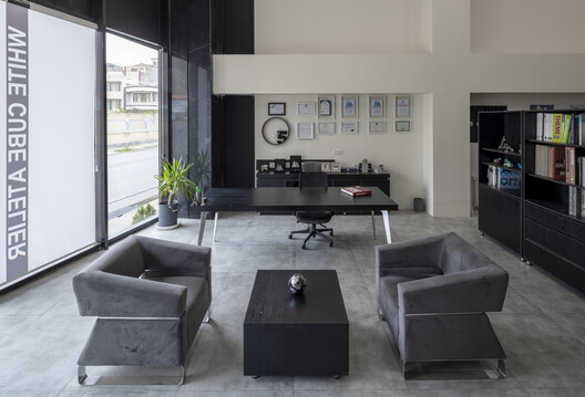 Ramand Mixed-Use building / White Cube Atelier - Interior Photography, Living Room, Lighting, Table, Chair, Shelving