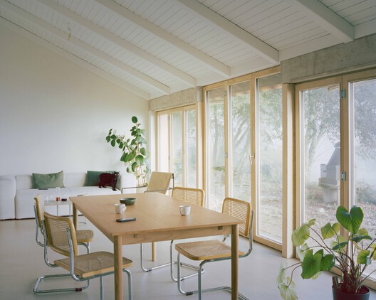 Family Villa / Noue Studio Family Villa / Noue Studio - Interior Photography, Dining room, Wood, Chair, Table, Glass