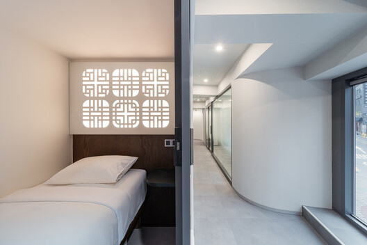 Hotel Myeongdong Station / Yong Ju Lee Architecture - Interior Photography, Bedroom, Wood, Lighting, Bed
