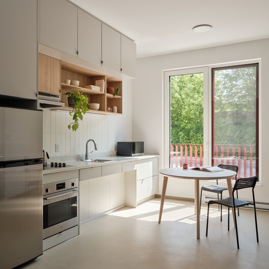 Place Tenaquip - Affordable Housing Units / L. McComber  - Interior Photography, Kitchen, Wood, Countertop, Chair, Lighting