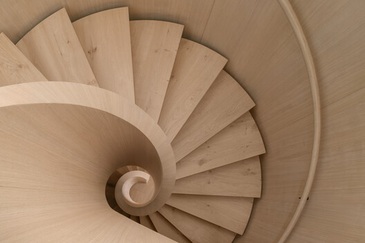 Transforming a Concrete Shell into a Wooden Interior Shaped by the Sea - Image 1 of 15