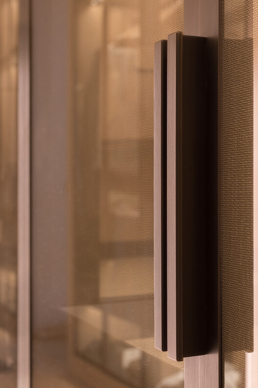 Transforming a Concrete Shell into a Wooden Interior Shaped by the Sea - Image 10 of 15