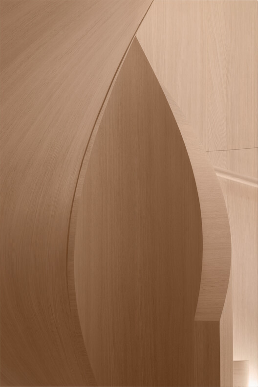 Transforming a Concrete Shell into a Wooden Interior Shaped by the Sea - Image 13 of 15