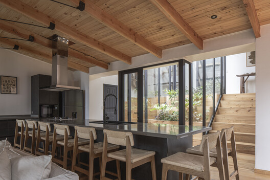Casa La Ladera / Estudio Diagonal - Interior Photography, Dining room, Wood, Table, Chair, Lighting, Beam, Door
