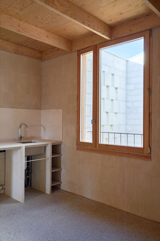Ten Social Housing Units in Santa Margalida, Mallorca / Javier Gavín + Siddartha Rodrigo + Juan Moreno + DATAAE - Interior Photography, Kitchen, Wood