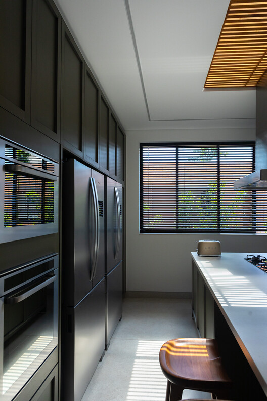 GLG Residence / Ximenes Leite Arquitetura - Interior Photography, Kitchen, Wood, Lighting, Countertop, Glass