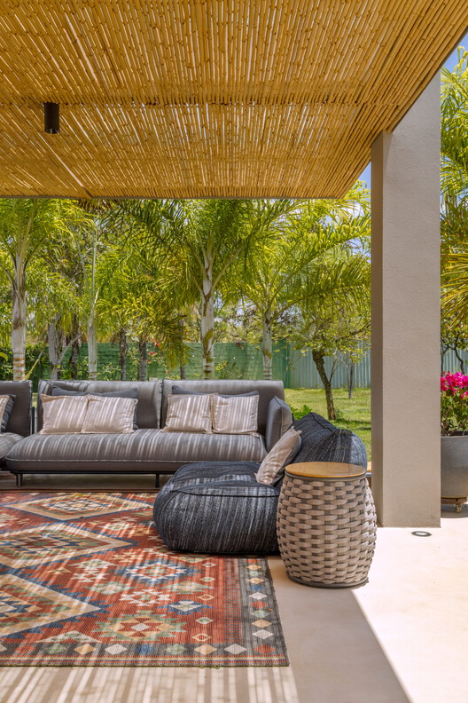 Boutique House / Studio Gontijo Arquitetura Boutique House / Studio Gontijo Arquitetura - Interior Photography, Living Room, Wood, Chair, Patio