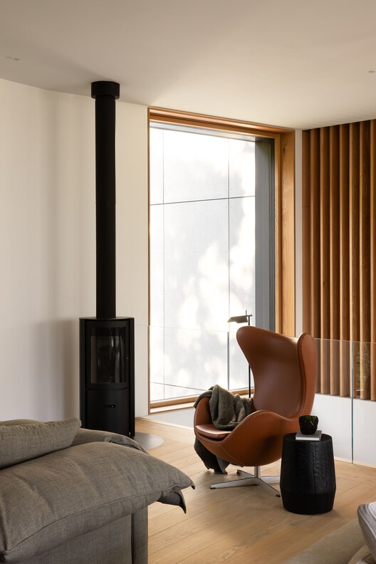 Passive House Forest Retreat / Stark - Interior Photography, Living Room, Wood, Lighting, Chair