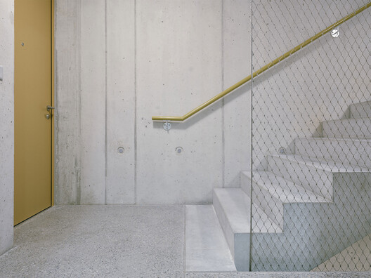 Apartment Block Grundmühle / dolmus Architekten - Interior Photography, Stairs, Handrail, Concrete
