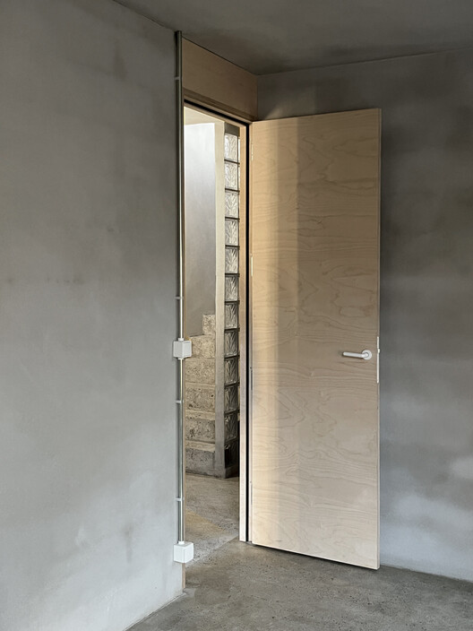 L33 Narrow House / BAST L33 Narrow House / BAST - Interior Photography, Wood, Door, Concrete