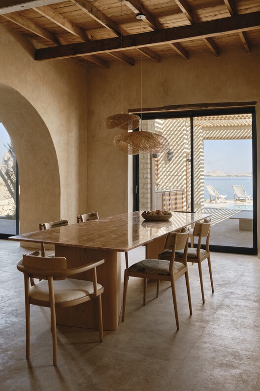Gagy Self-Sufficient House / Kareem Aldomiaty + Ehab Aldomiaty Gagy Self-Sufficient House / Kareem Aldomiaty + Ehab Aldomiaty - Interior Photography, Dining room, Wood, Table, Chair