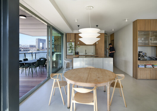 KAAP - Residential District and Circular Pavilion / Powerhouse Company + Orange Architects + NEXT architects KAAP - Residential District and Circular Pavilion / Powerhouse Company + Orange Architects + NEXT architects - Interior Photography, Dining room, Wood, Table, Chair, Lighting, Glass