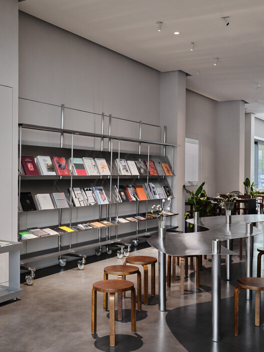 JER café at Tselinny Center of Contemporary Culture / NAAW JER café at Tselinny Center of Contemporary Culture / NAAW - Interior Photography, Shelving, Chair