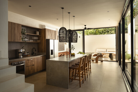 El Molino Residential Development / FAMM Arquitectura El Molino Residential Development / FAMM Arquitectura - Interior Photography, Kitchen, Wood, Countertop, Table, Lighting, Chair