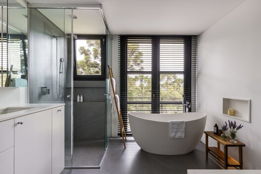 Terra Catarina House / Nola Arquitetura - Interior Photography, Bathroom, Lighting, Bathtub, Door, Sink, Glass, Toilet