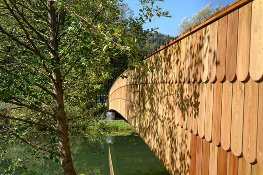 The Pedestrian Bridge across the River Rinža / dans arhitekti The Pedestrian Bridge across the River Rinža / dans arhitekti - Exterior Photography, Wood