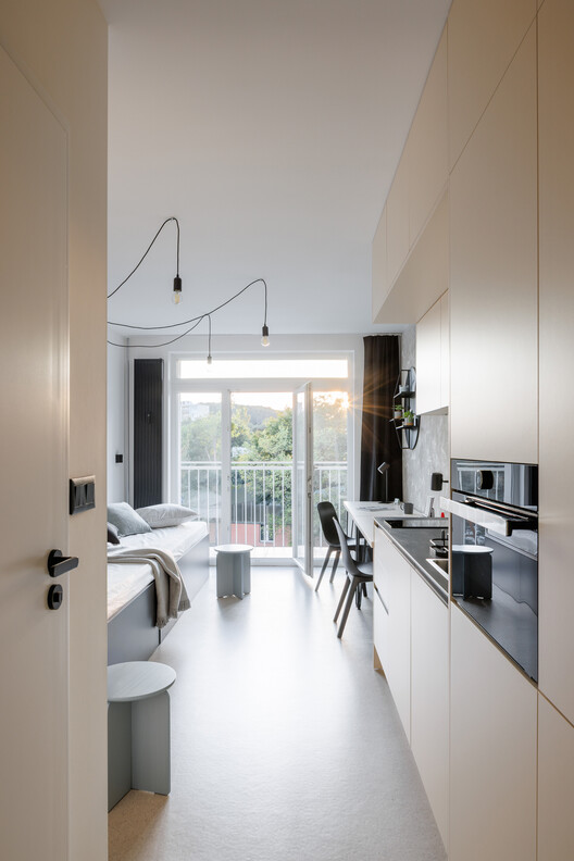 KOSMALT Housing Renovation / Atrium Architekti - Interior Photography, Kitchen, Wood, Countertop, Lighting, Chair, Glass