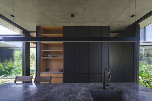 Courtyard House / Estudio Simbiosis - Interior Photography, Kitchen, Wood