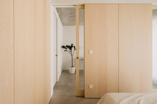 Apartment in the Heart of Jeżyce in Poznań / LBWA Apartment in the Heart of Jeżyce in Poznań / LBWA - Interior Photography, Bedroom, Wood, Door