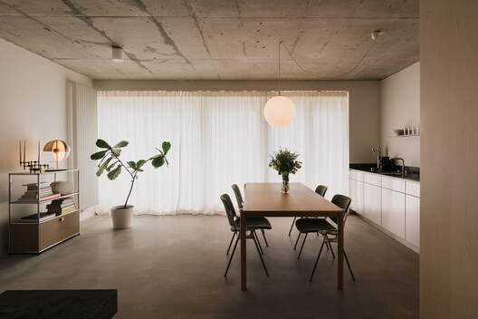 Apartment in the Heart of Jeżyce in Poznań / LBWA Apartment in the Heart of Jeżyce in Poznań / LBWA - Interior Photography, Dining room, Wood, Lighting, Table, Chair