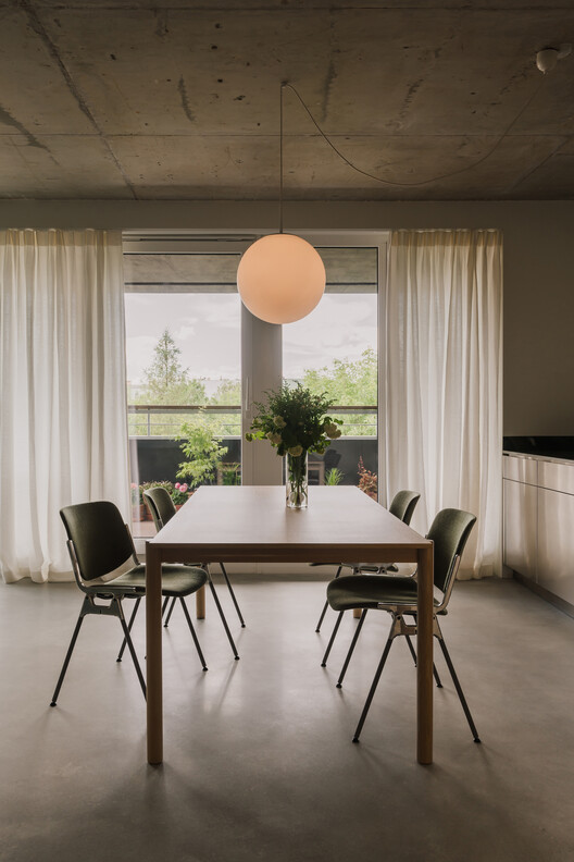 Apartment in the Heart of Jeżyce in Poznań / LBWA Apartment in the Heart of Jeżyce in Poznań / LBWA - Interior Photography, Dining room, Wood, Table, Chair, Lighting