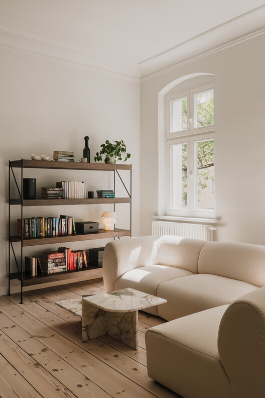 Apartment Interior within Poznań's Łazarz District / LBWA Apartment Interior within Poznań's Łazarz District / LBWA - Interior Photography, Living Room, Wood, Shelving, Chair