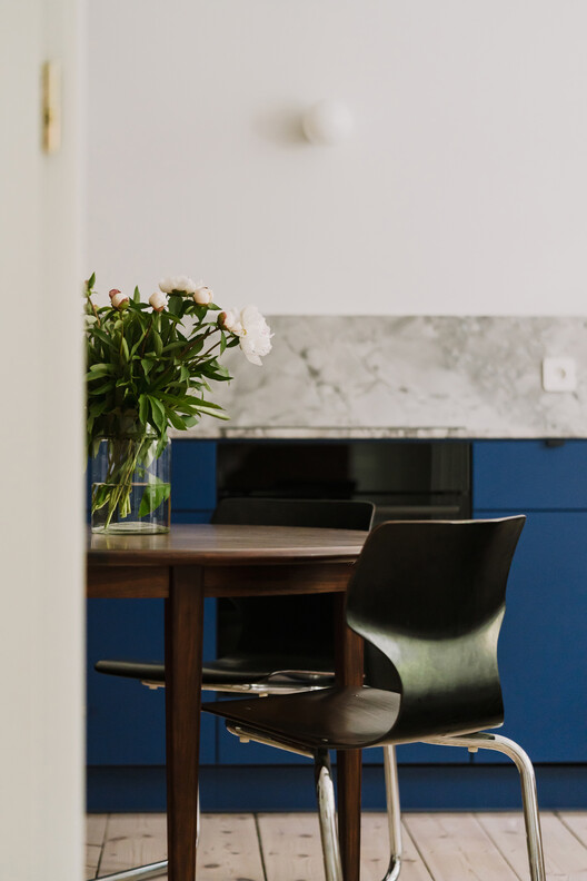 Apartment Interior within Poznań's Łazarz District / LBWA Apartment Interior within Poznań's Łazarz District / LBWA - Interior Photography, Table, Lighting, Chair, Countertop