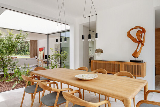 Full Renovation LVL / Ábaton Full Renovation LVL / Ábaton - Interior Photography, Dining room, Wood, Table, Lighting, Chair, Door
