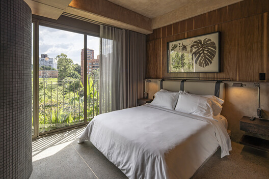 23 Living / Plan:b arquitectos 23 Living / Plan:b arquitectos - Interior Photography, Bedroom, Bed, Chair, Balcony