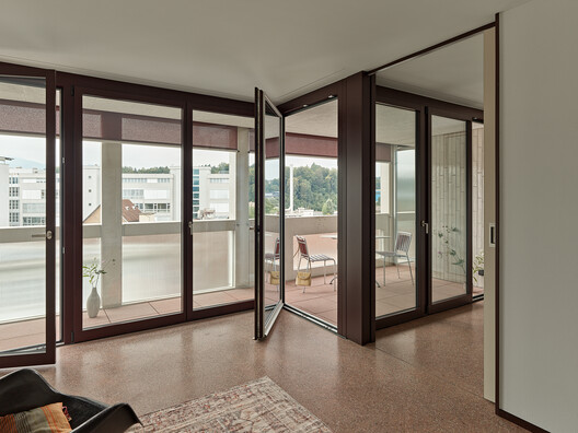 Housing on top of the petrol station / Gut Deubelbeiss Nill Architekten Housing on top of the petrol station / Gut Deubelbeiss Nill Architekten - Interior Photography, Wood, Door, Glass, Chair