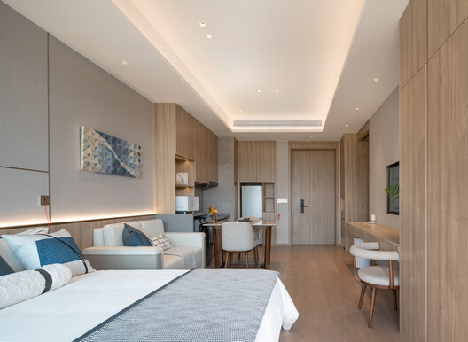 Shanghai Guohua Heyuejia International Senior Living Centre, Continuing Care Retirement Community / GN Architects Shanghai Guohua Heyuejia International Senior Living Centre, Continuing Care Retirement Community / GN Architects - Interior Photography, Wood, Bedroom, Bed